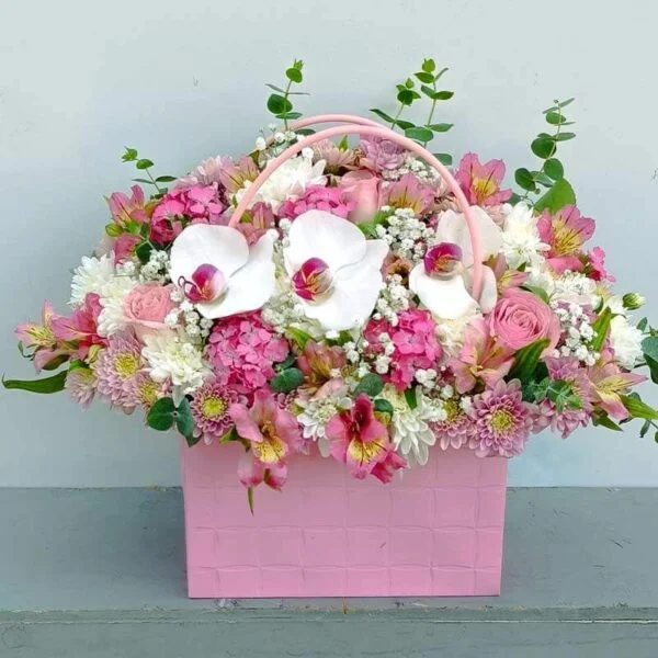 Main image of Elegant Pink Flower Box with Orchids, Roses, and Seasonal Flowers – Perfect for Birthday Surprises
